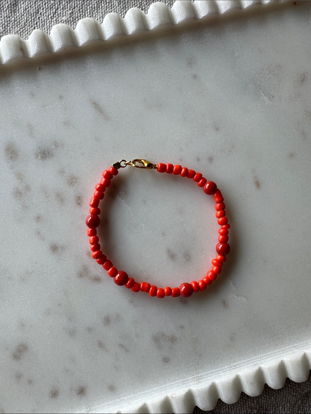 Orange Glass Seed Bead Bracelet With Gold Clasp 7 inches